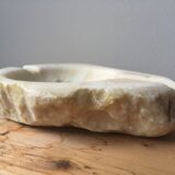 White marble ashtray with a raw appearance