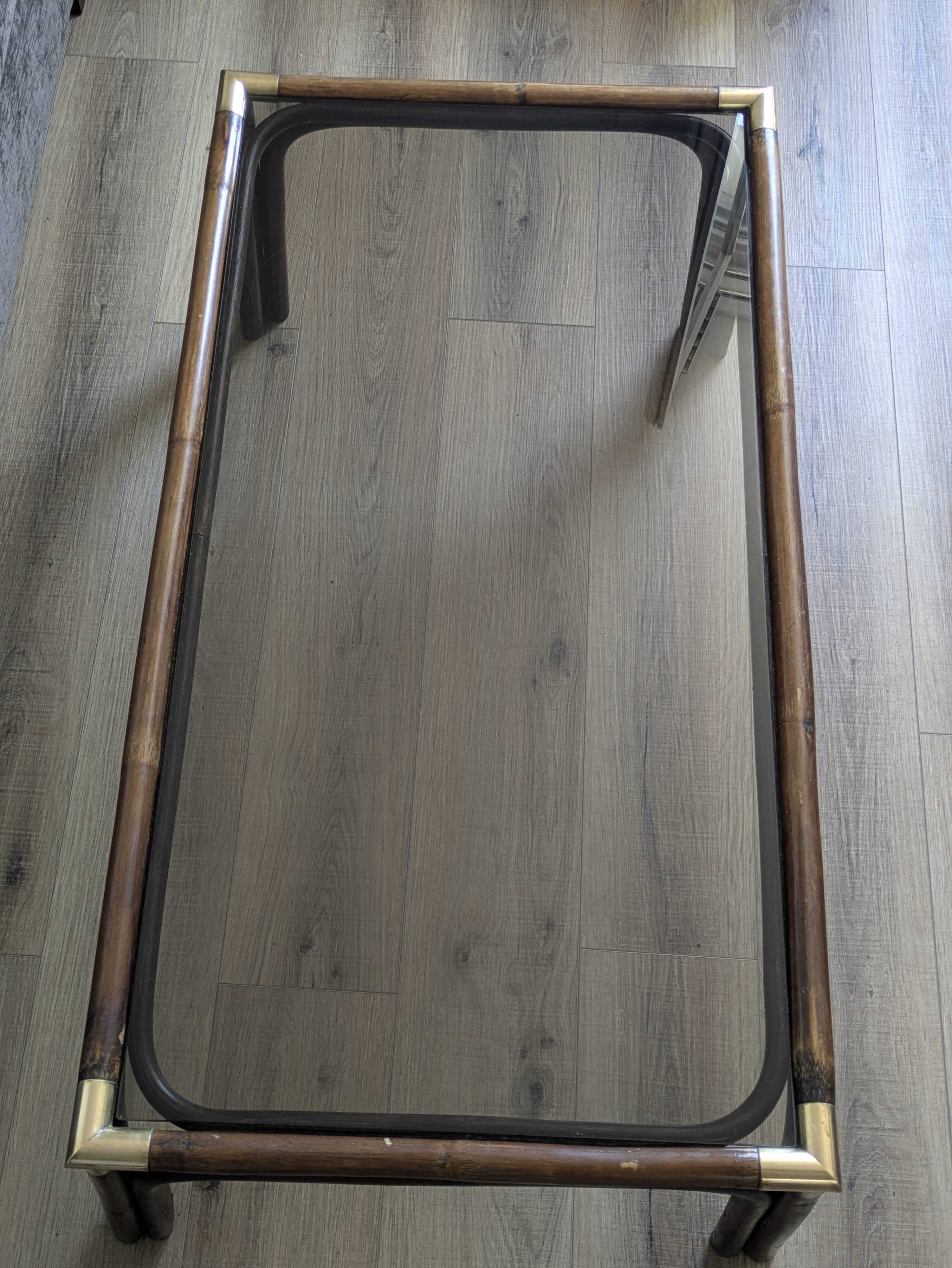 Bamboo coffee table with brass corners and smoked glass