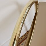 Pair of bedside tables with gold metal and mirrored glass top.
