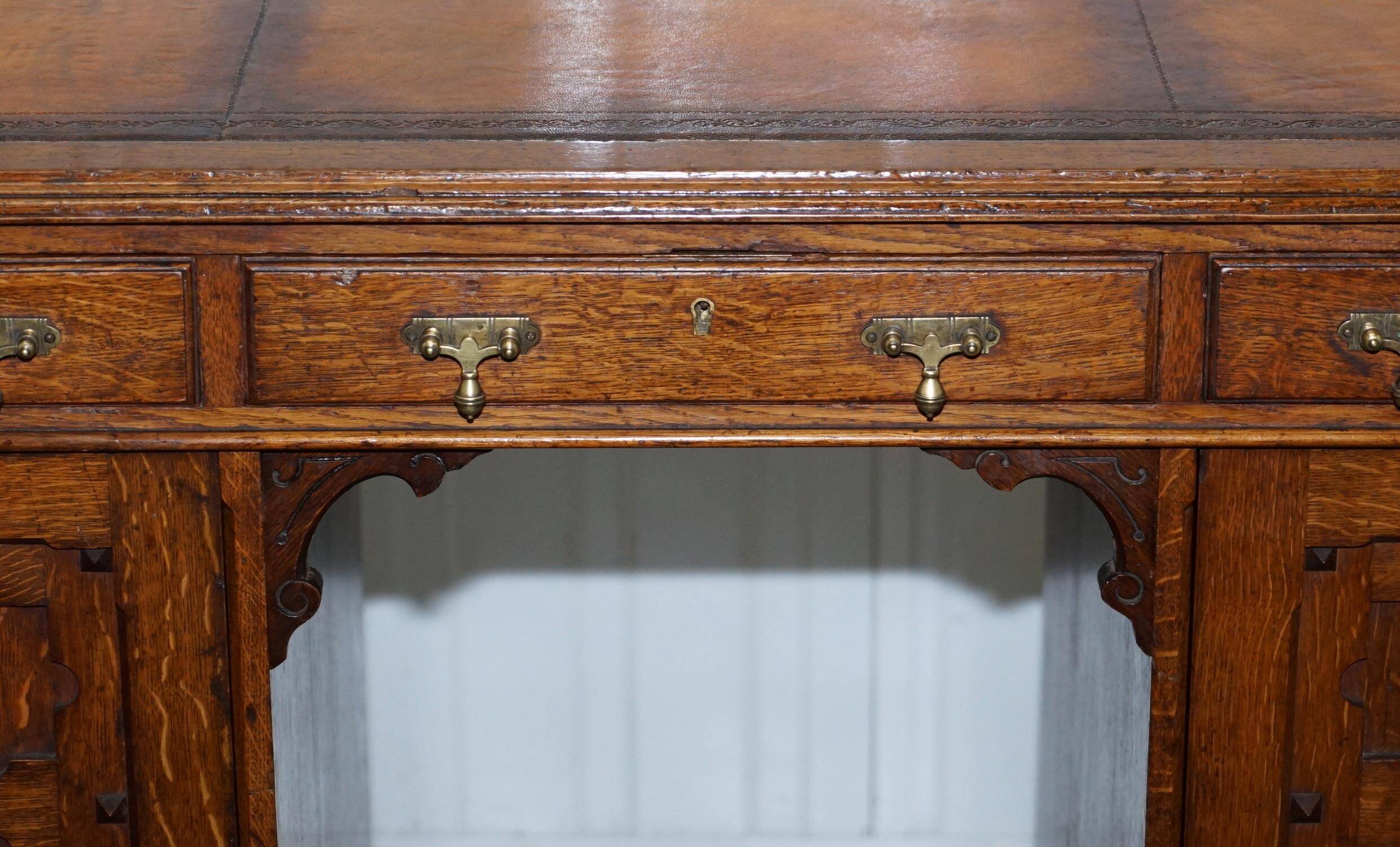 Restored Gothic desk with side bookshelves, drawer, and sloping top by Pugin Gillows.