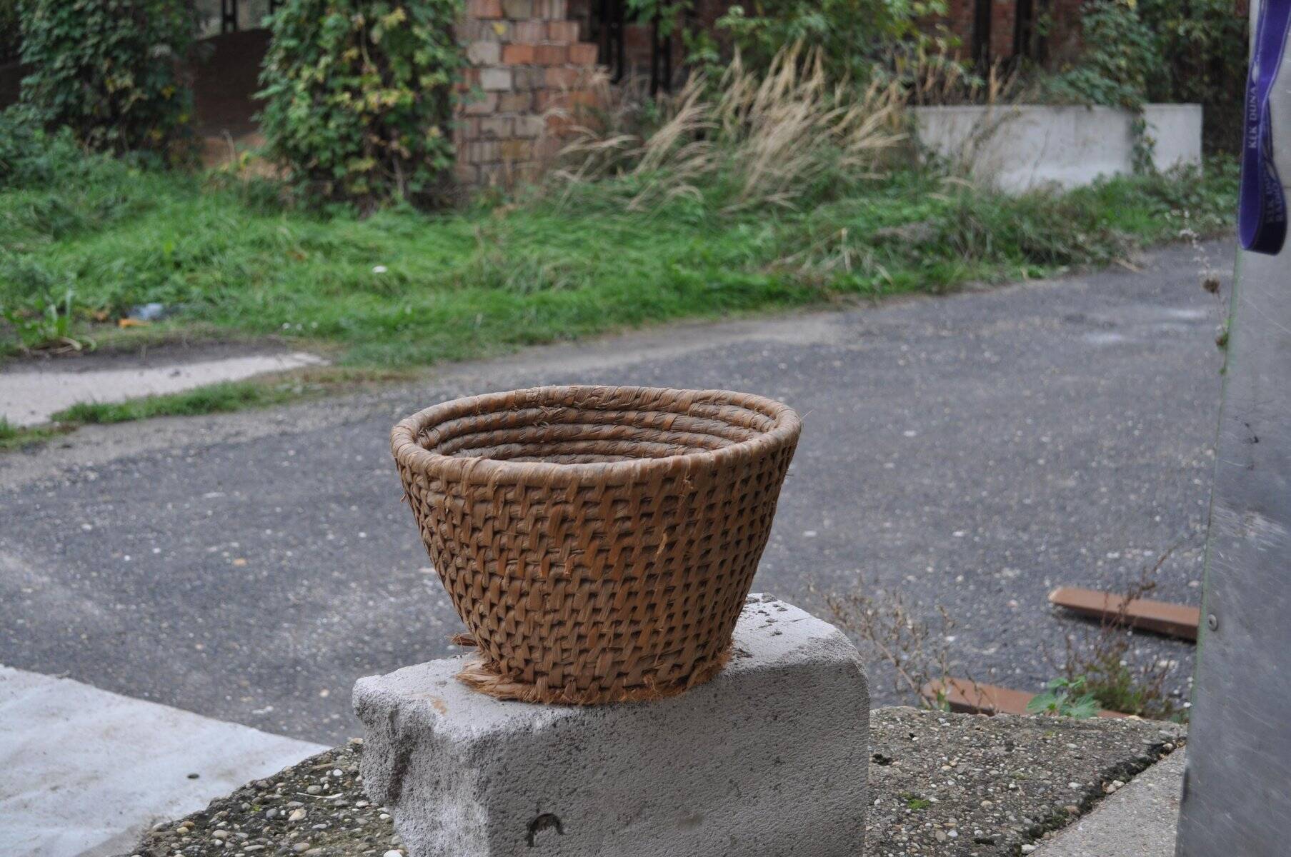 Brown woven wicker basket, 1940s, vintage French utilitarian egg basket.