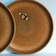 Four vintage glazed stoneware potter's plates