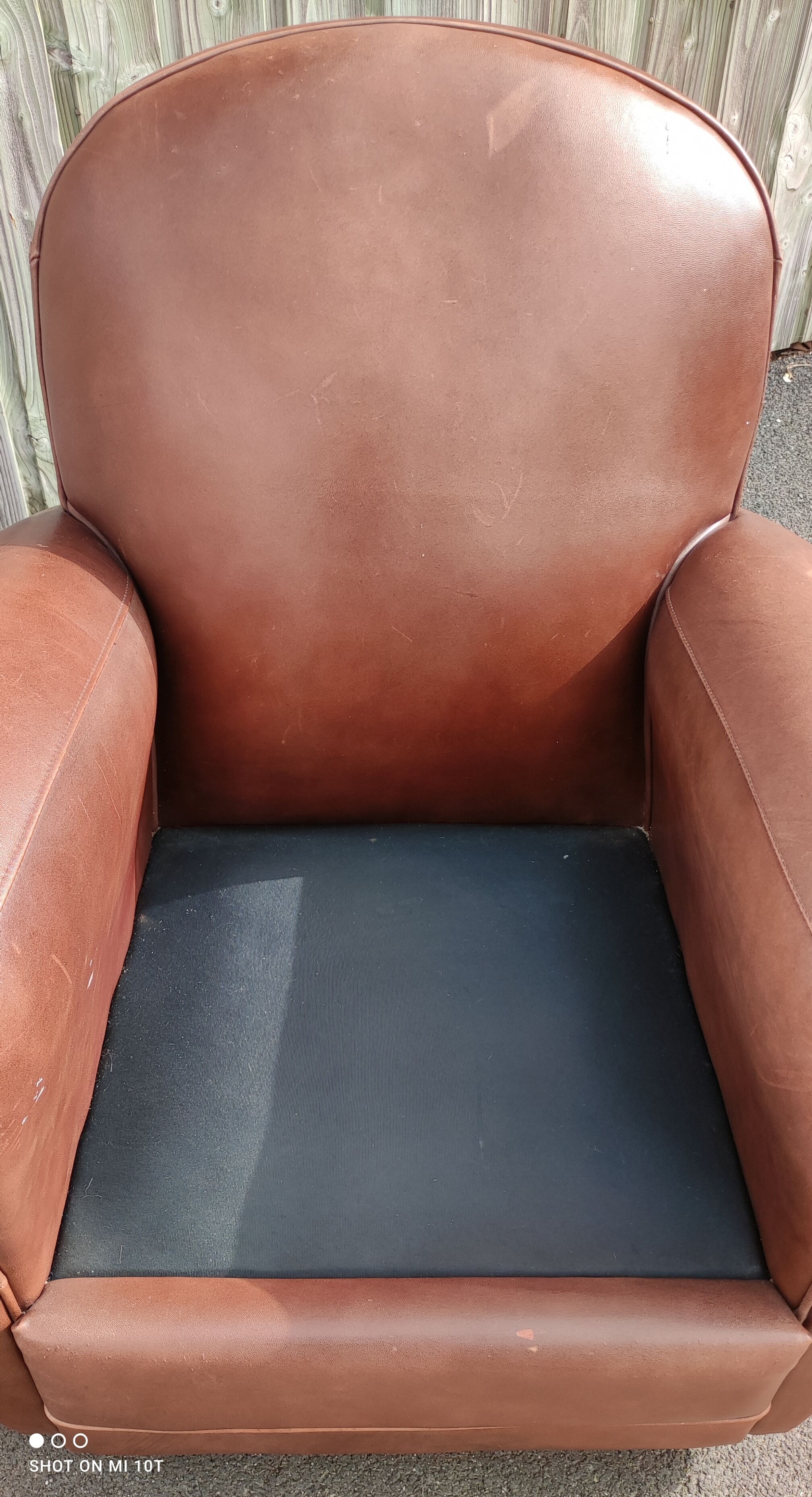 Club chair in brown leather