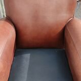 Club chair in brown leather