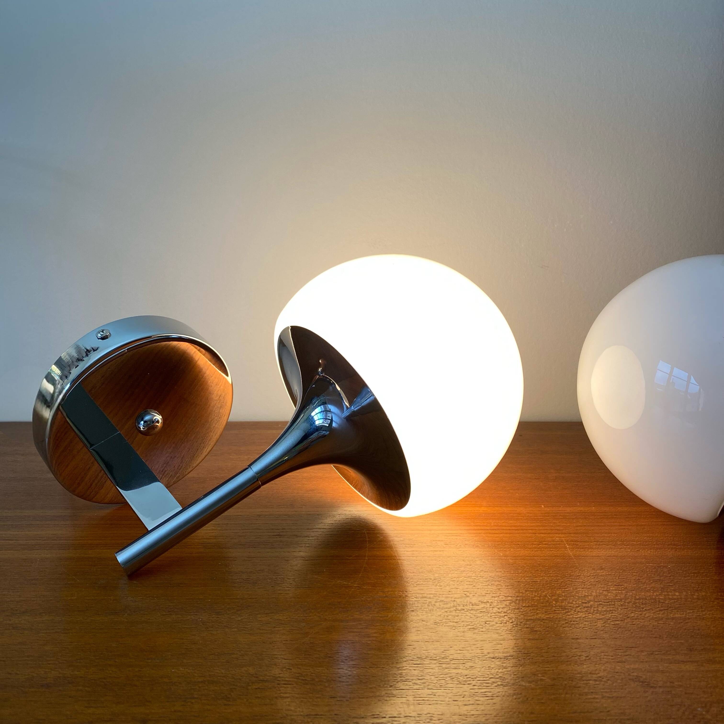 Pair of seventies wall sconces with chrome metal and opaline glass globe.
