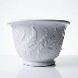 Antique cache-pot in Limoges porcelain with a relief decoration of foliage.