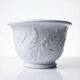 Antique cache-pot in Limoges porcelain with a relief decoration of foliage.
