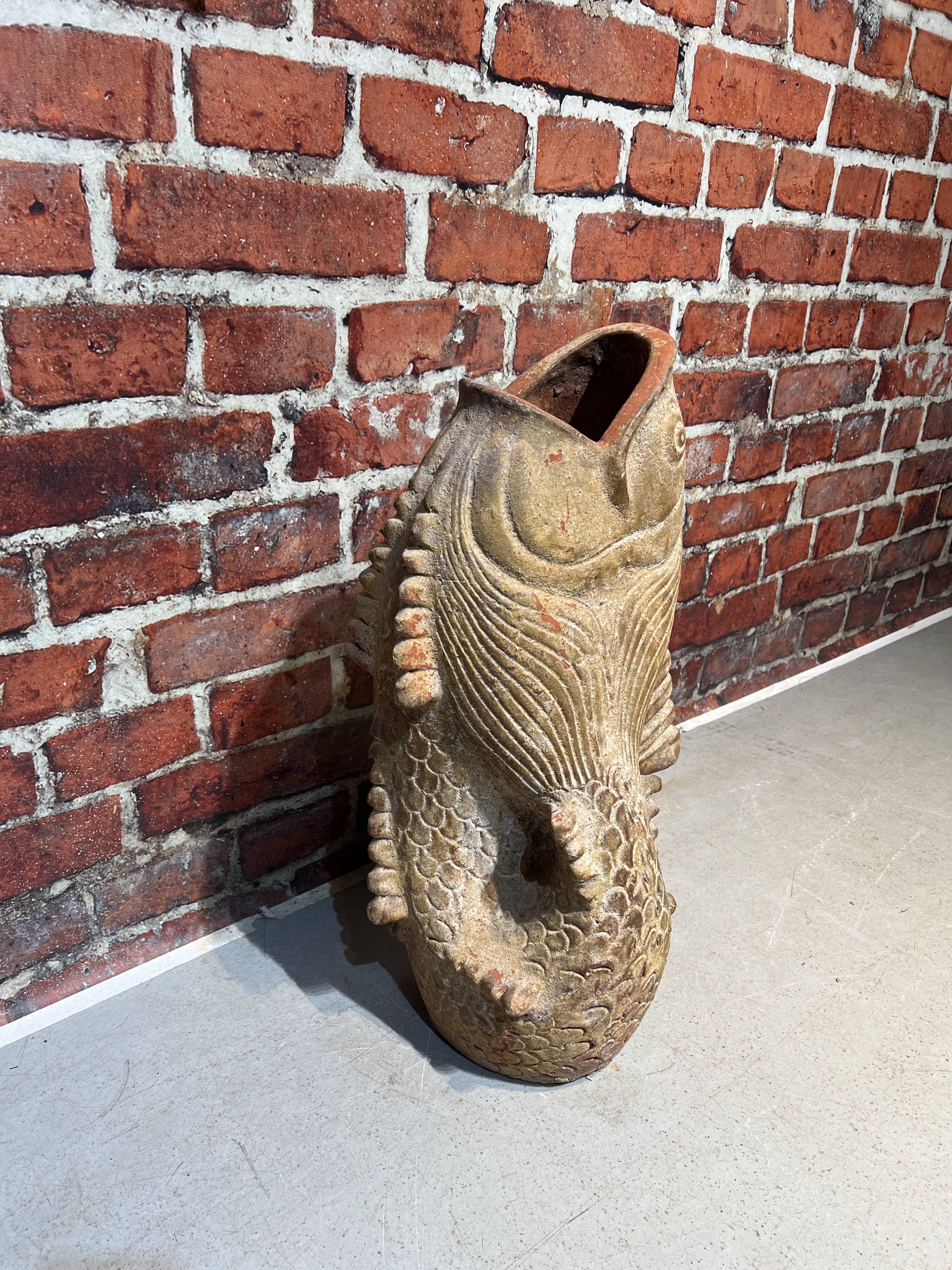Terracotta umbrella stand in the shape of a fish