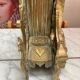 Fireplace trim clock and adornment of antique bronze candelabra