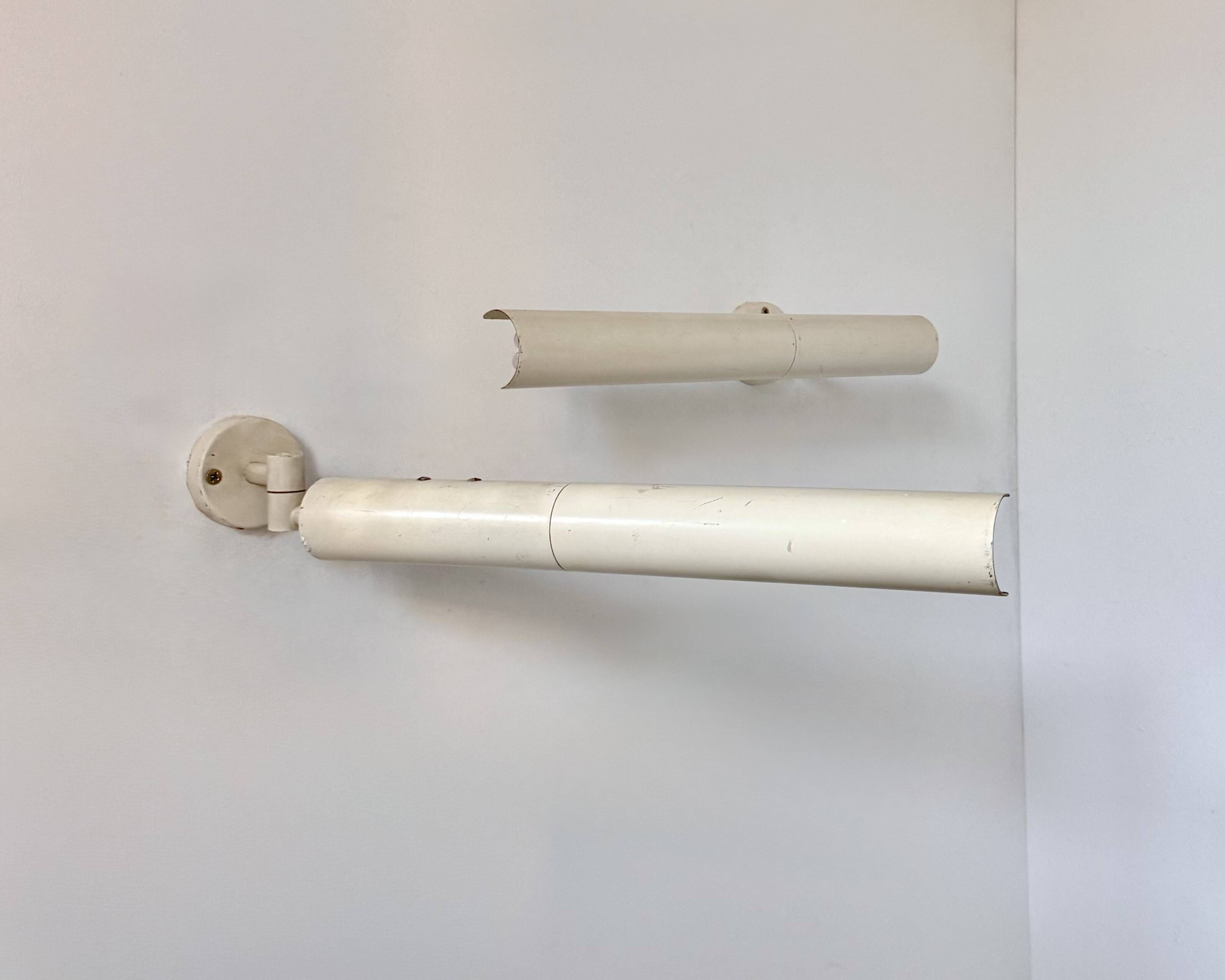 Pair of vintage matte white metal wall lights, France 1970.