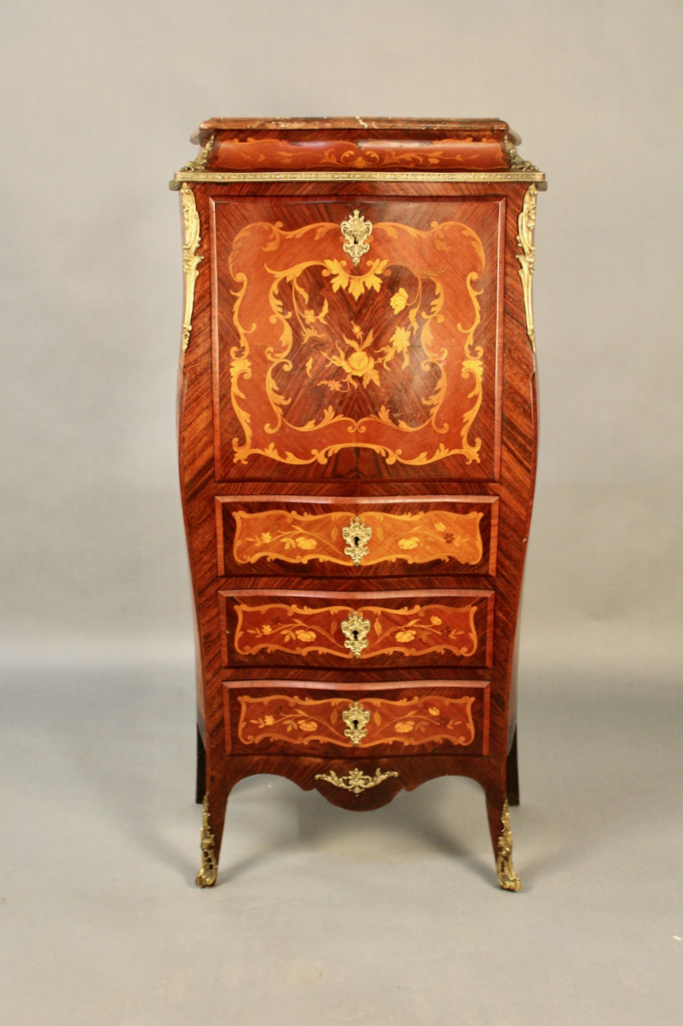 Secrétaire de dame marqueté galbé de style Louis XV