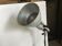 Industrial lamp on wrought iron tripod feet
