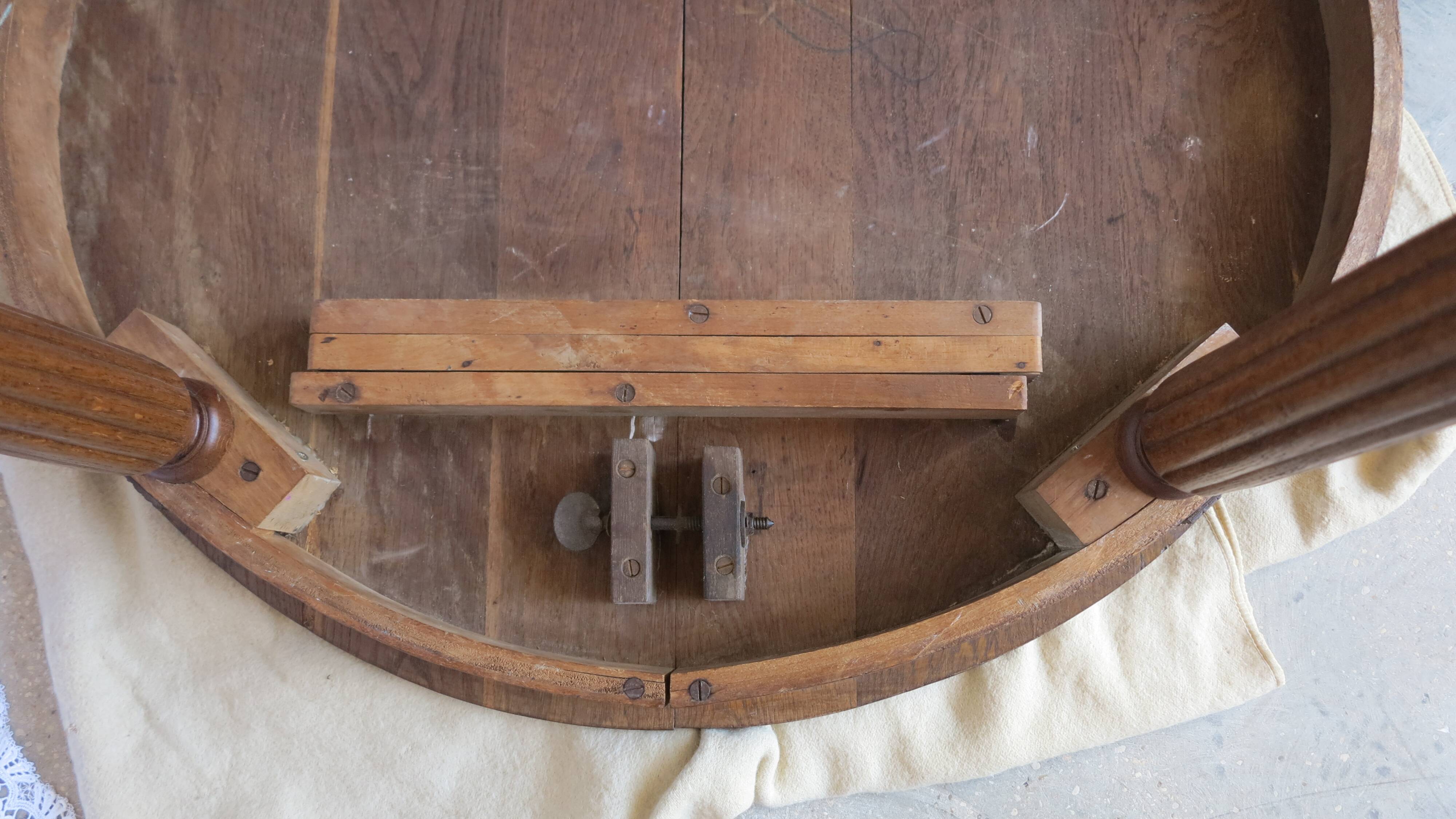 1930s oak dining table, slightly oval.