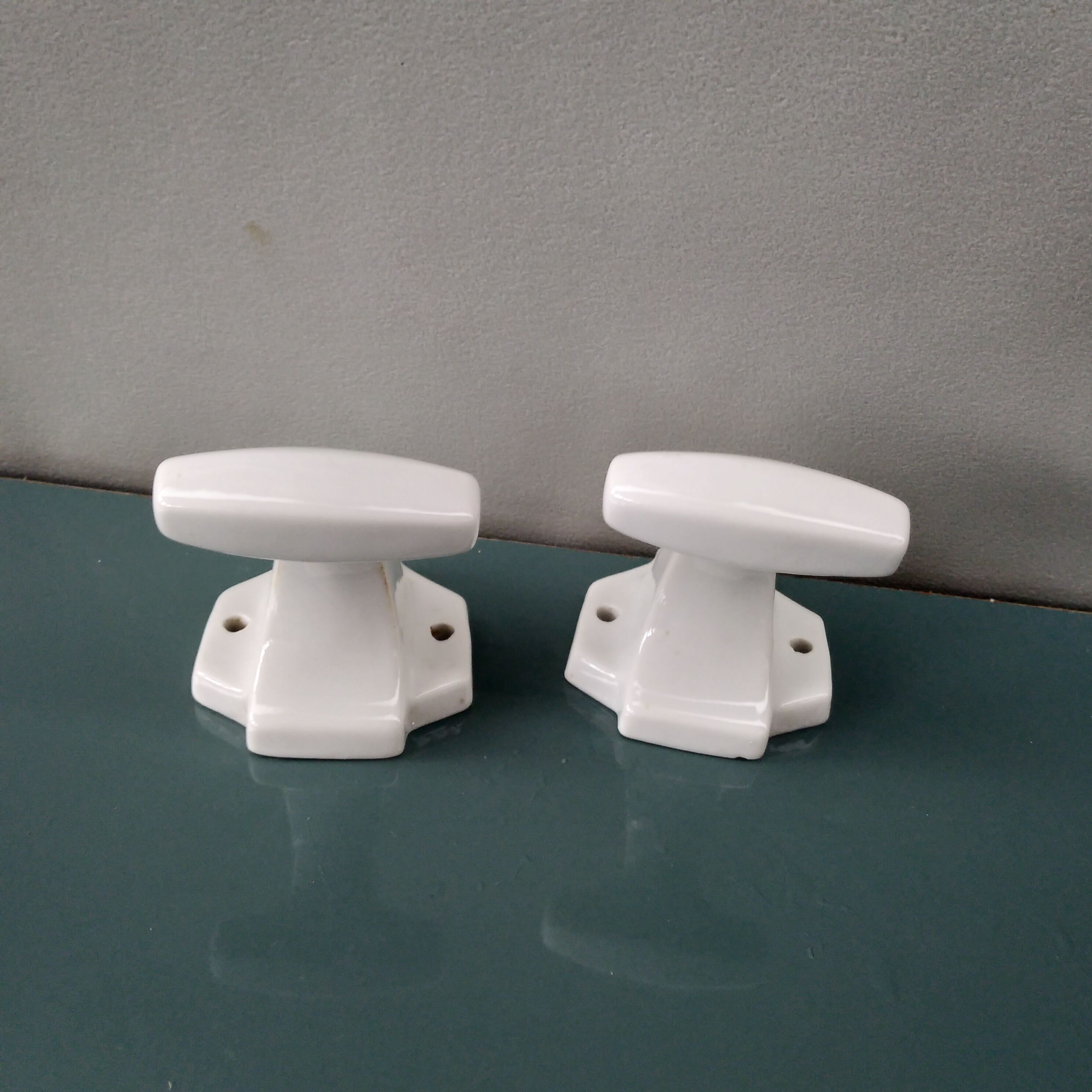 Pair of art deco porcelain coat racks