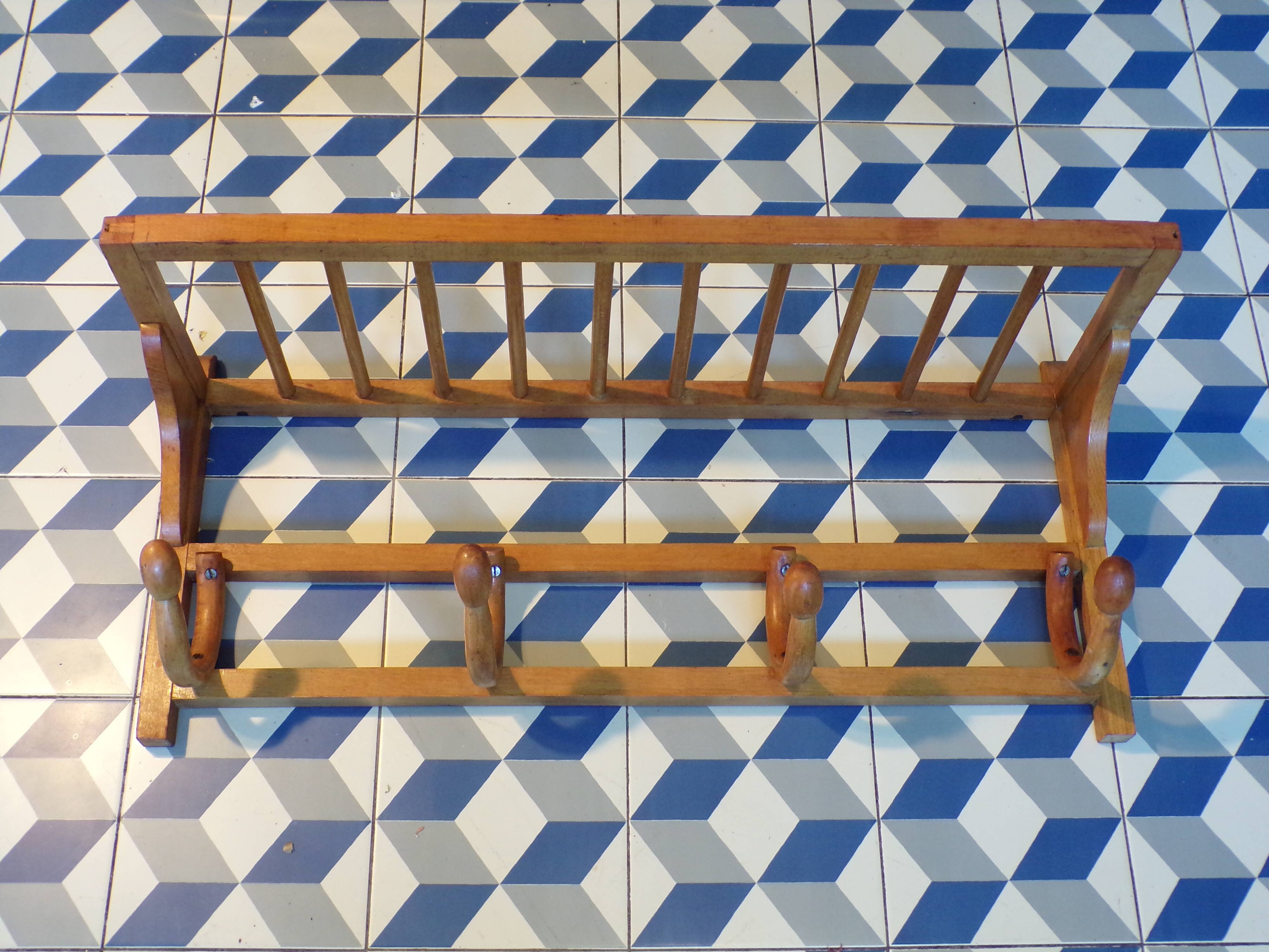 Curved wooden coat rack with shelf
