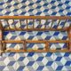 Curved wooden coat rack with shelf