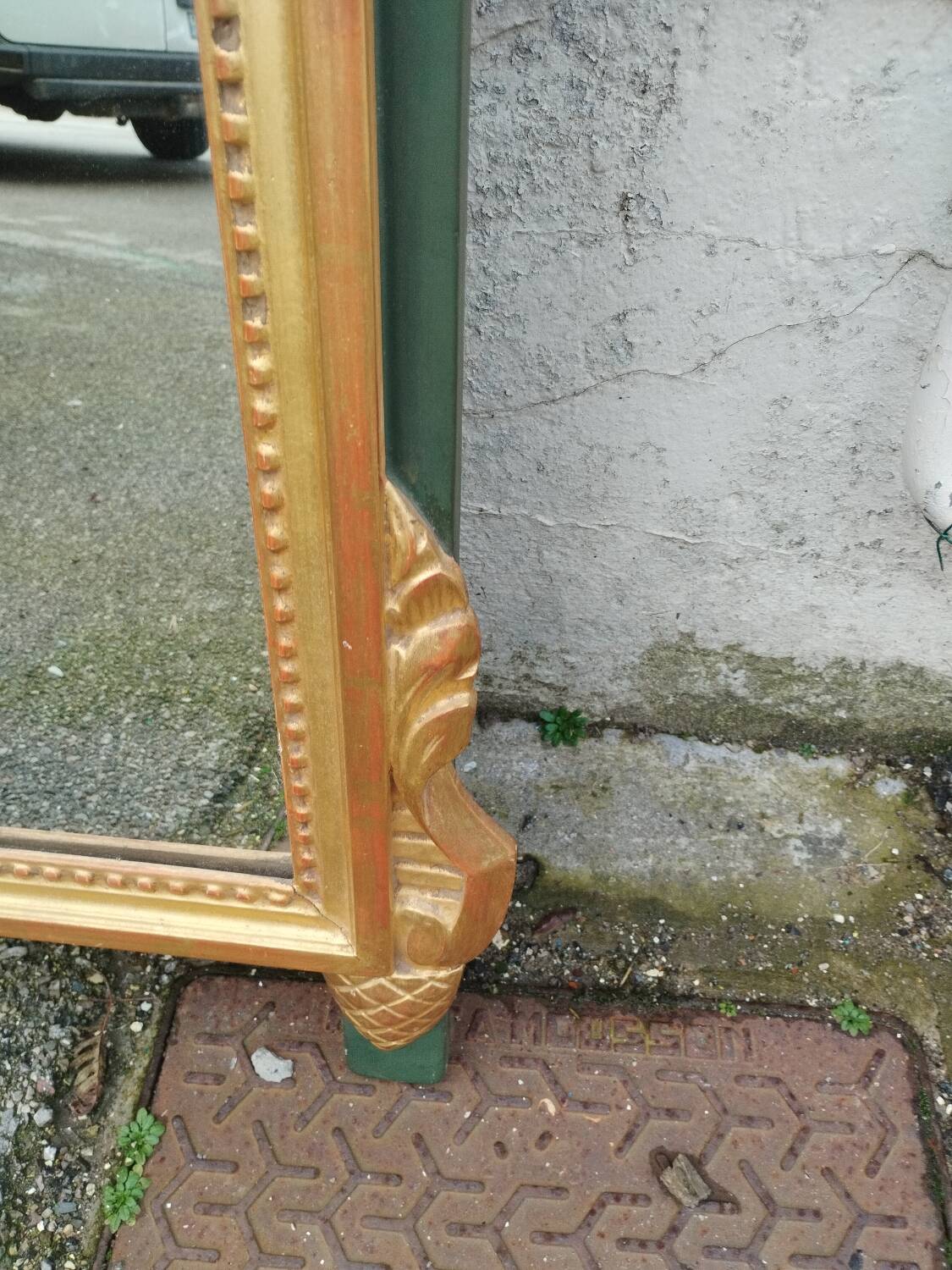Antique gilded wooden mirror in Louis XVI style