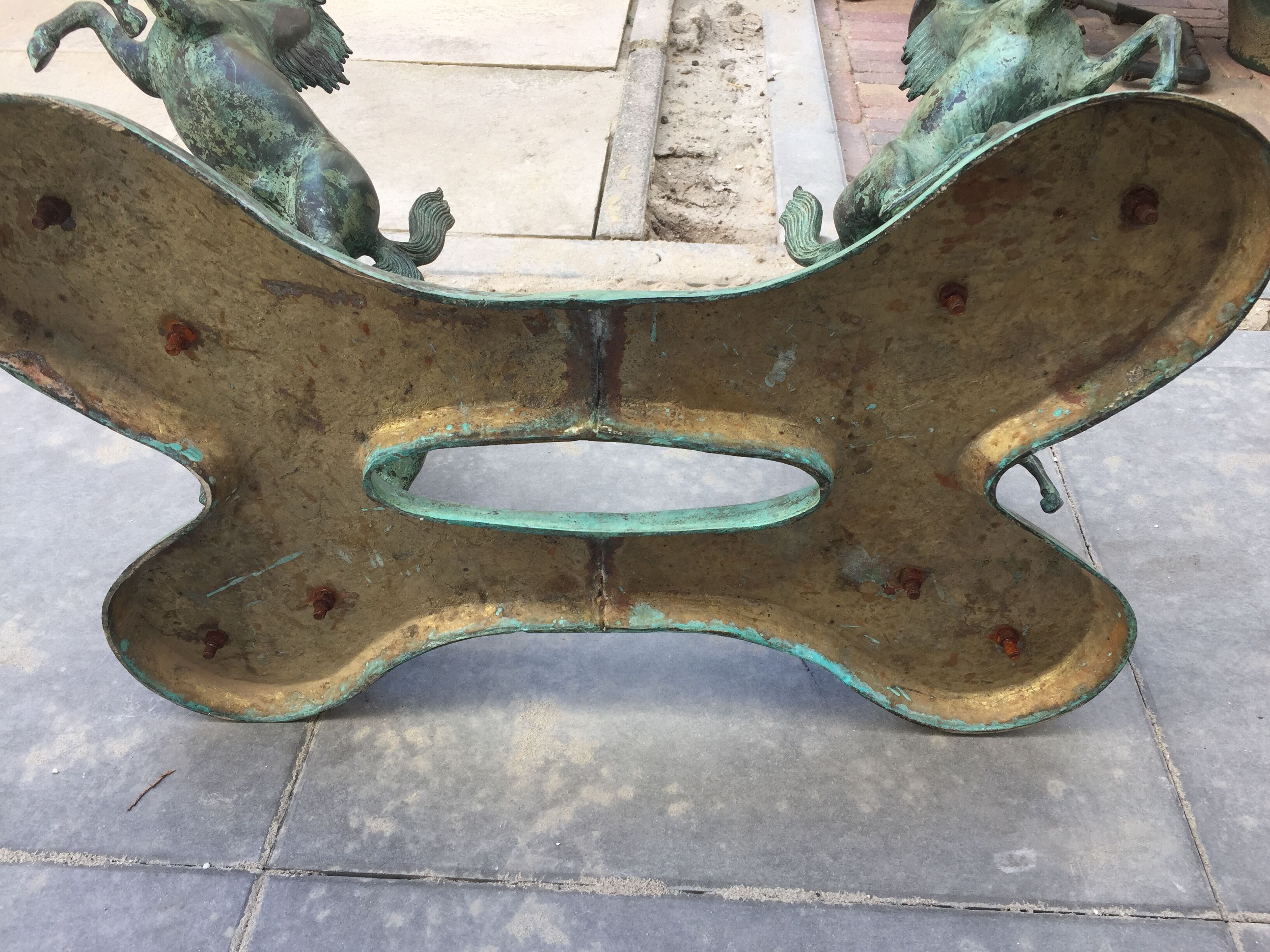 Coffee table with glass plate and bronze horses