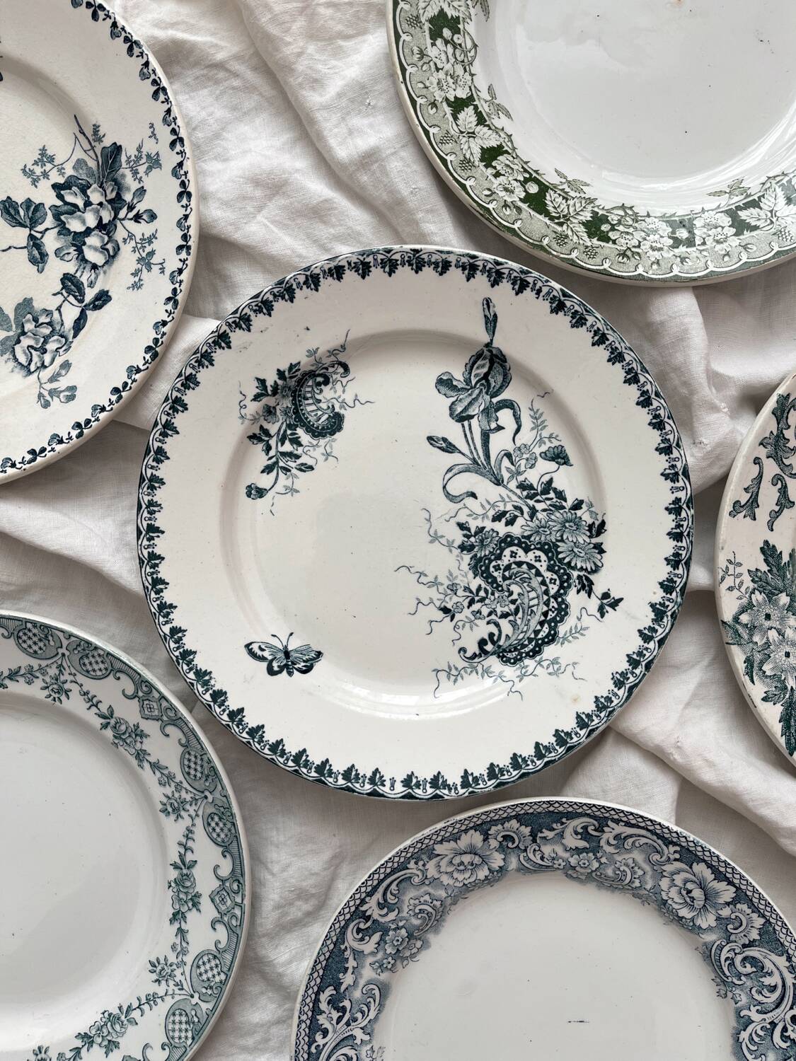 6 mismatched Saint Amand ironware dessert plates