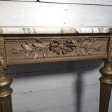 Louis XVI style console in gilded wood with a marble top.