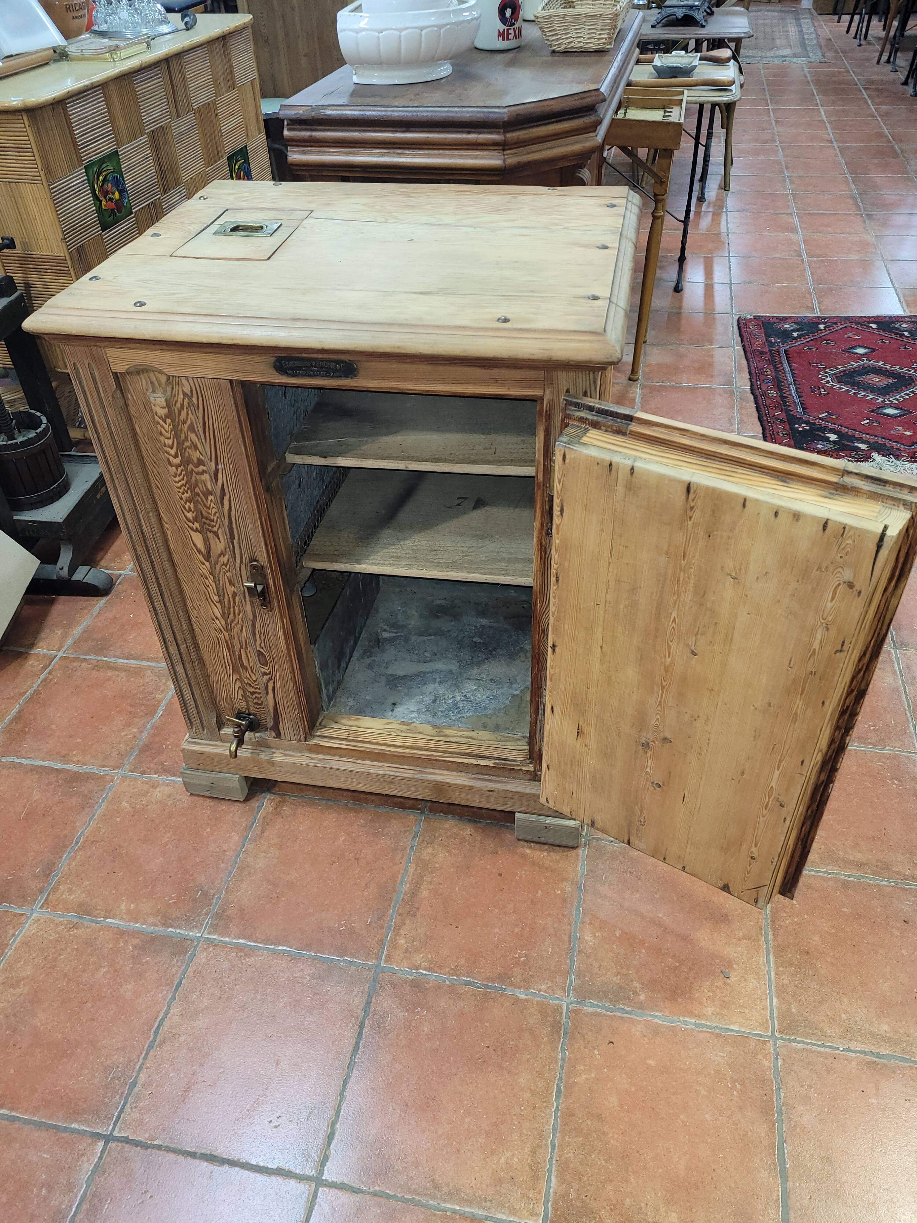 Antique cooler with a door