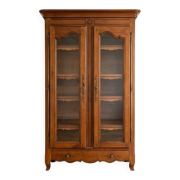Louis XV style library in cherry wood with glass doors.