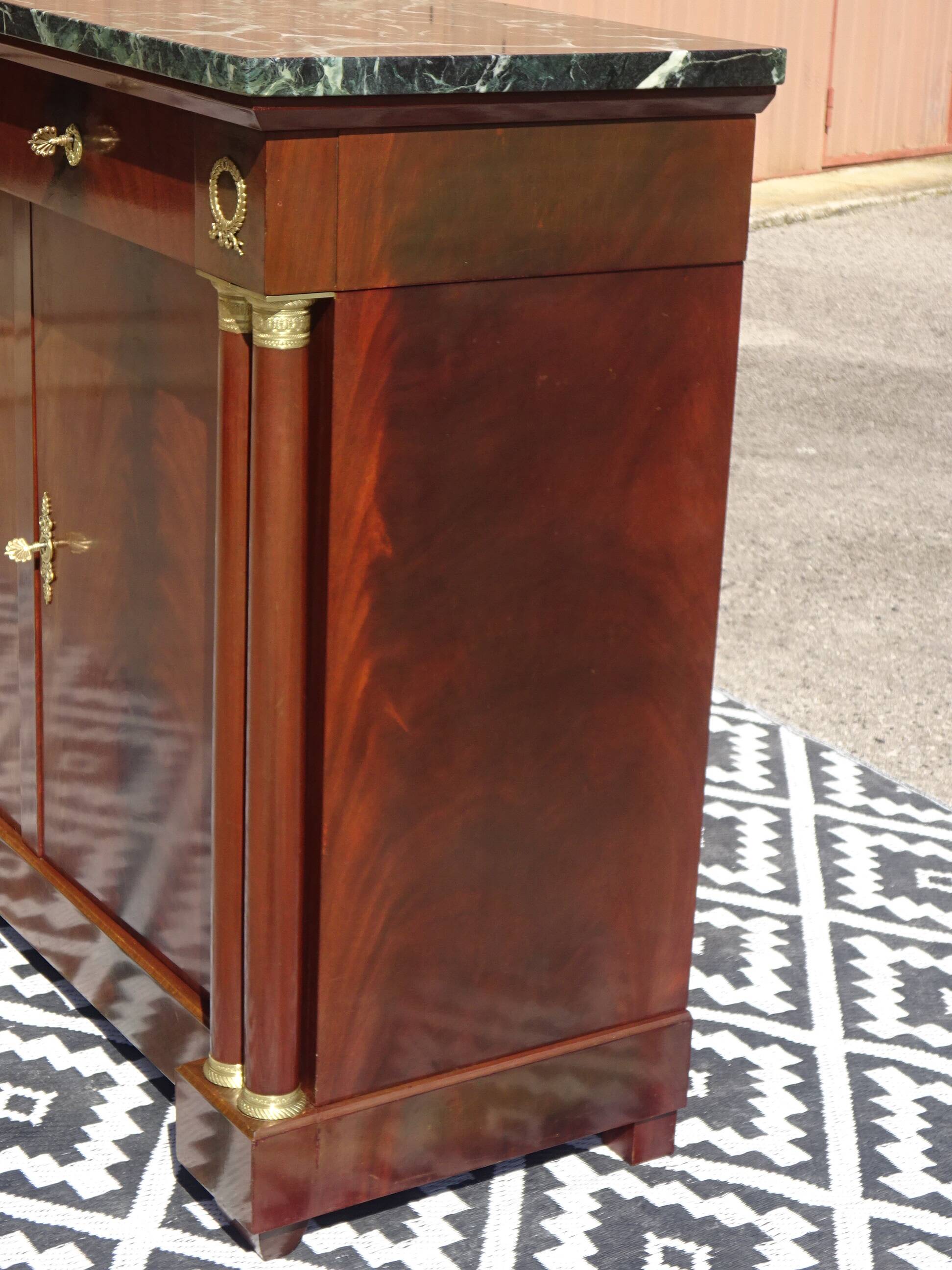 Flamed mahogany enfilade with sea green marble in Empire style.