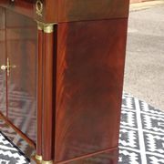 Flamed mahogany enfilade with sea green marble in Empire style.
