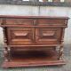 Henri II style console table with a red marble top.
