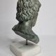 Bust of Esculape in patinated plaster on marble base, 21 cm