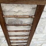 Old children's bed with retractable walnut bars