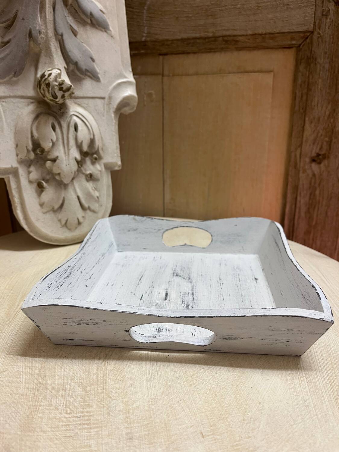 Old wooden tray with aged white patina