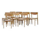 Ensemble de huit chaises de salle à manger en chêne modèle 501 A.M Møbler avec cordage en papier.