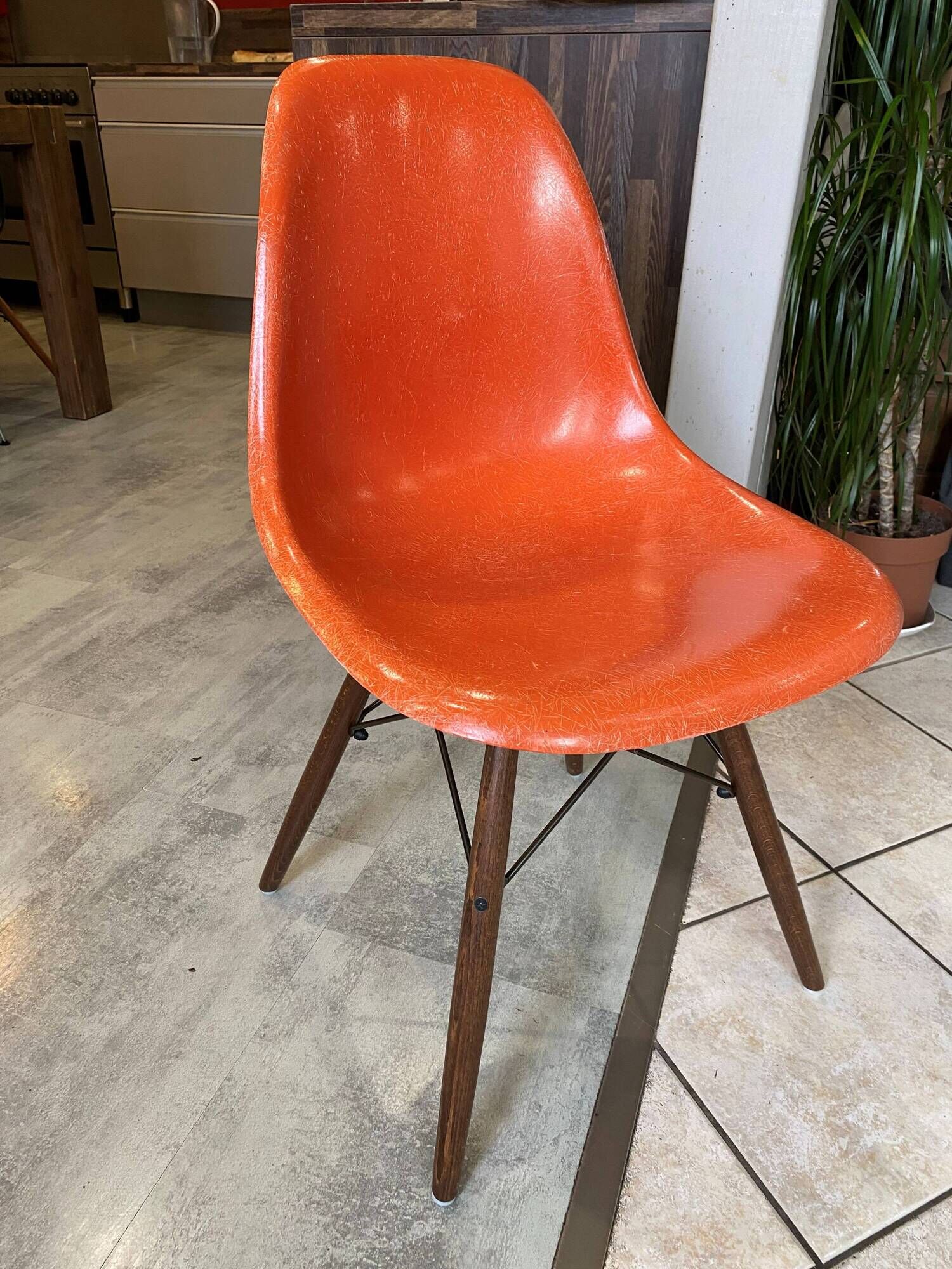 A vintage 70s Eames Herman Miller DSW Fiber Red Orange Dowel Walnut Chair