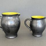 Two pitchers and three Elchinger ceramic bowls black and yellow background 1960