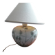 Antique ceramic lamp with a floral design.