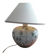 Antique ceramic lamp with a floral design.