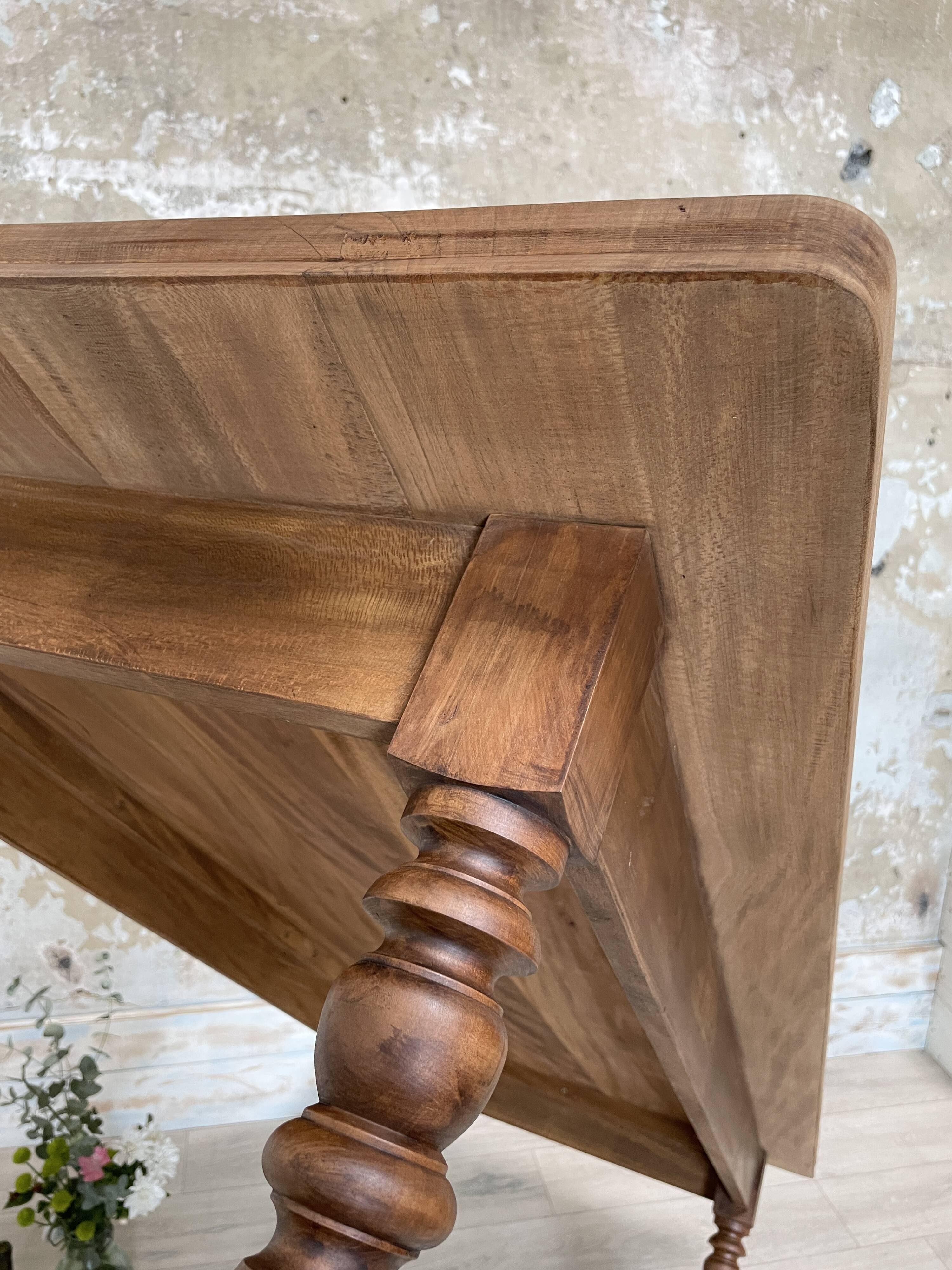 Vintage farmhouse table with turned legs.