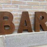 Bar sign in metal letters