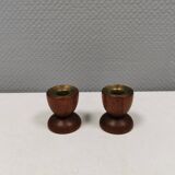Two beautiful teak candle holders with brass inserts.