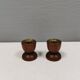 Two beautiful teak candle holders with brass inserts.
