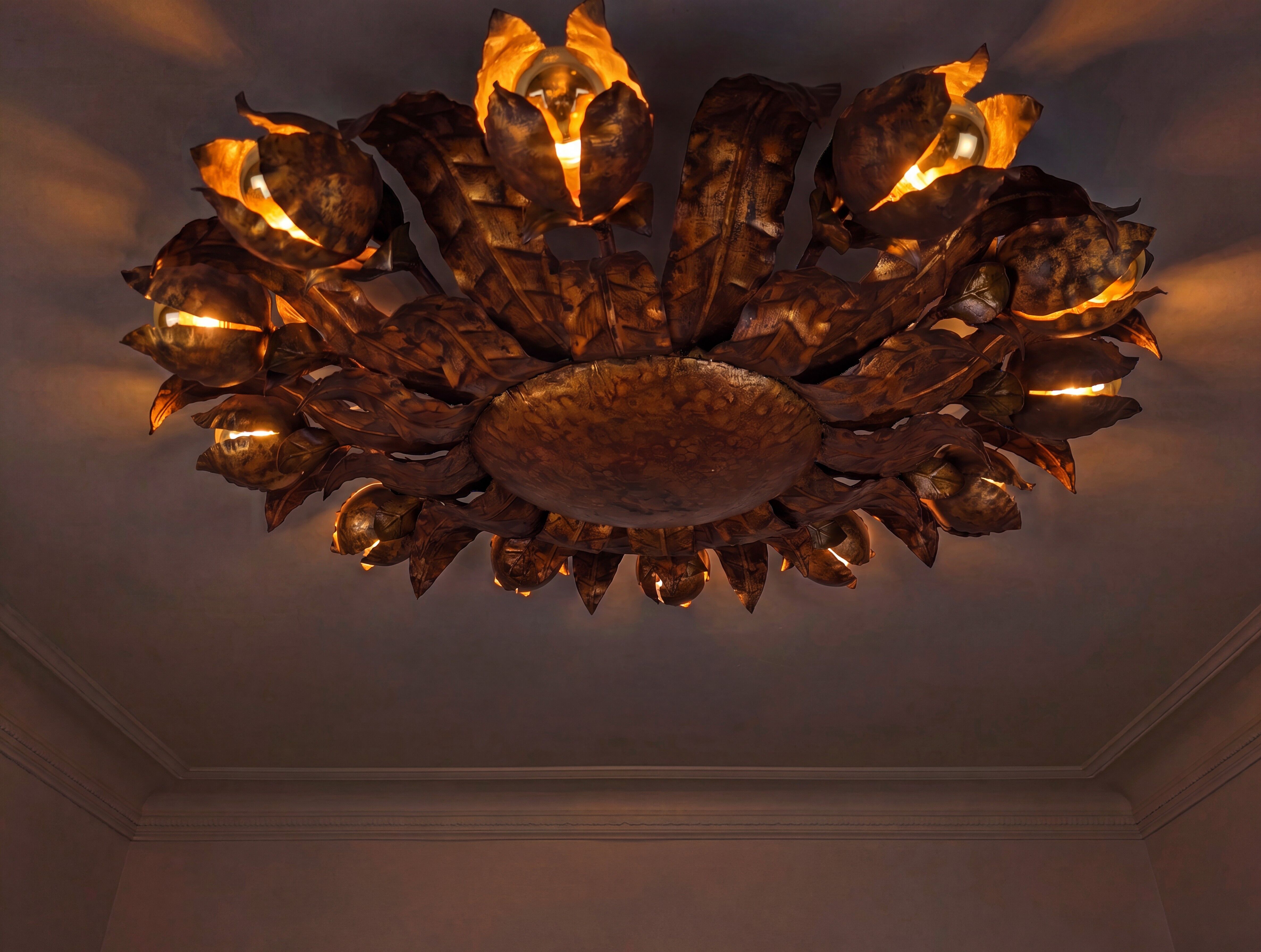 Large mid-century sunburst ceiling lamp, gilded metal with floral motif, 1950s