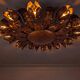 Large mid-century sunburst ceiling lamp, gilded metal with floral motif, 1950s