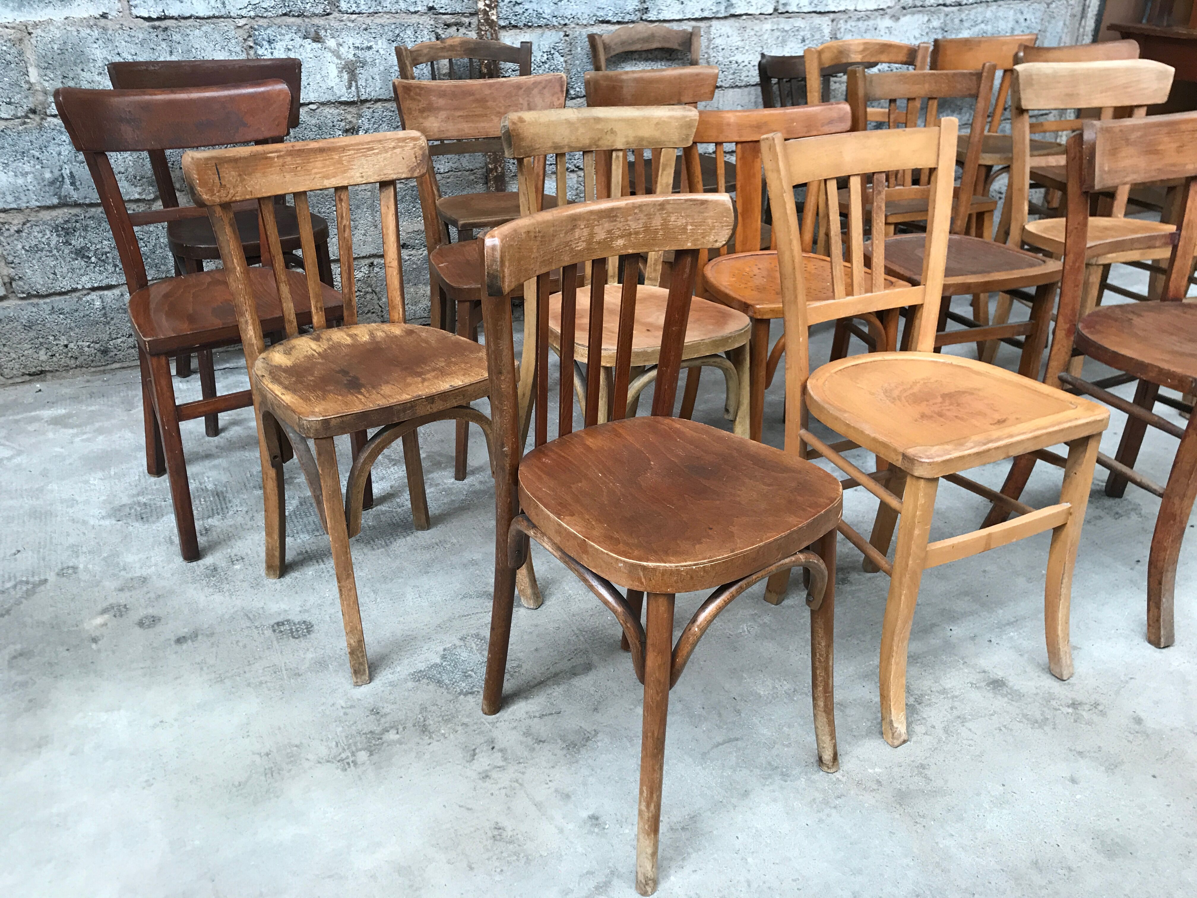 Set of 15 mismatched curved wood bistro chairs