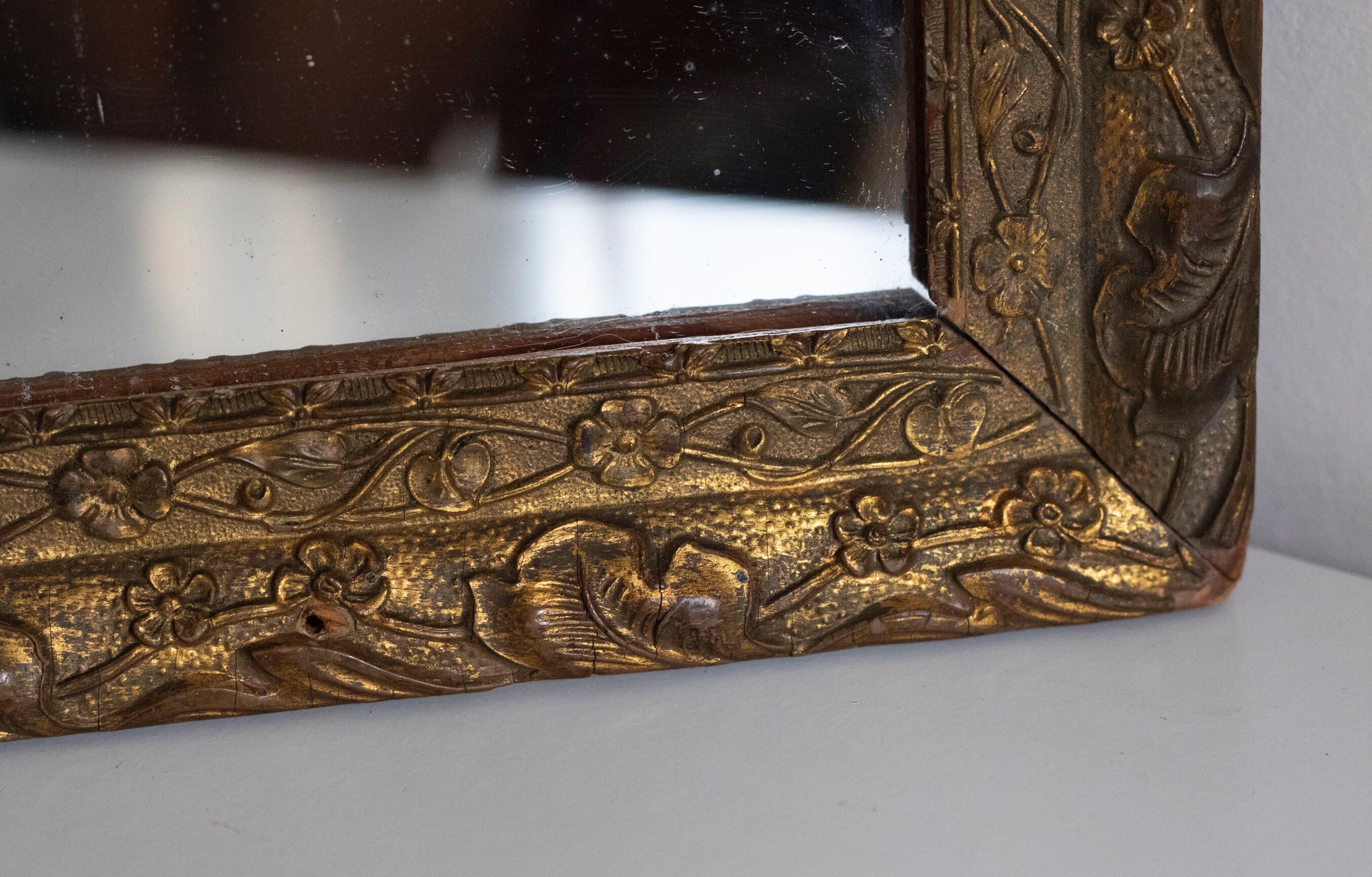 Antique mirror in gilded wood