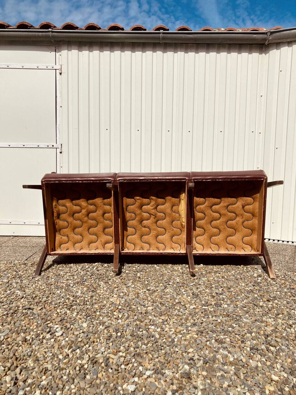 Three-seater patinated leather sofa, mid-century style.