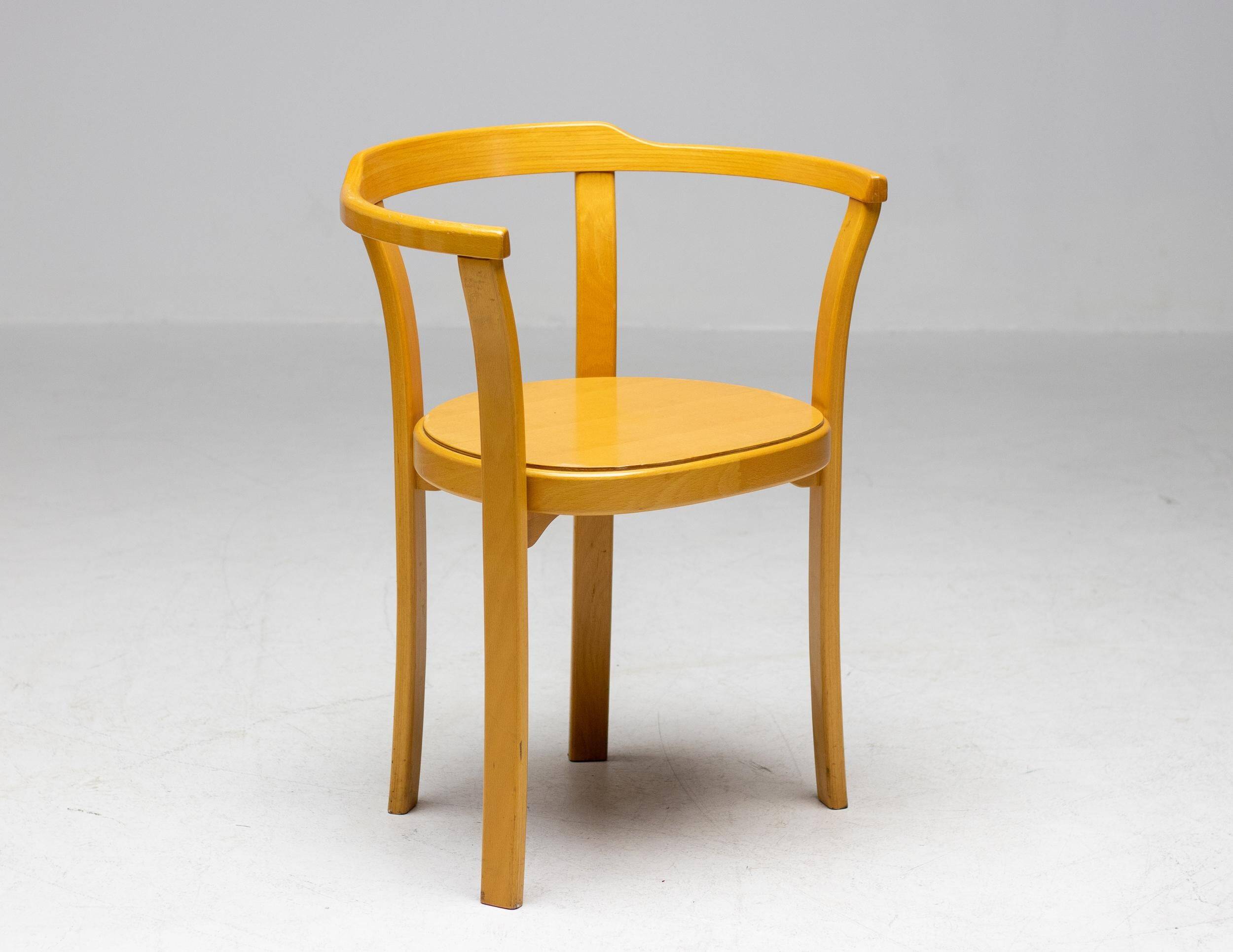 Stackable chairs in curved beech.