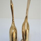 Pair of stylized birds in solid brass