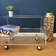 Altuglass roller TV table/furniture by David Lange with sliding tray