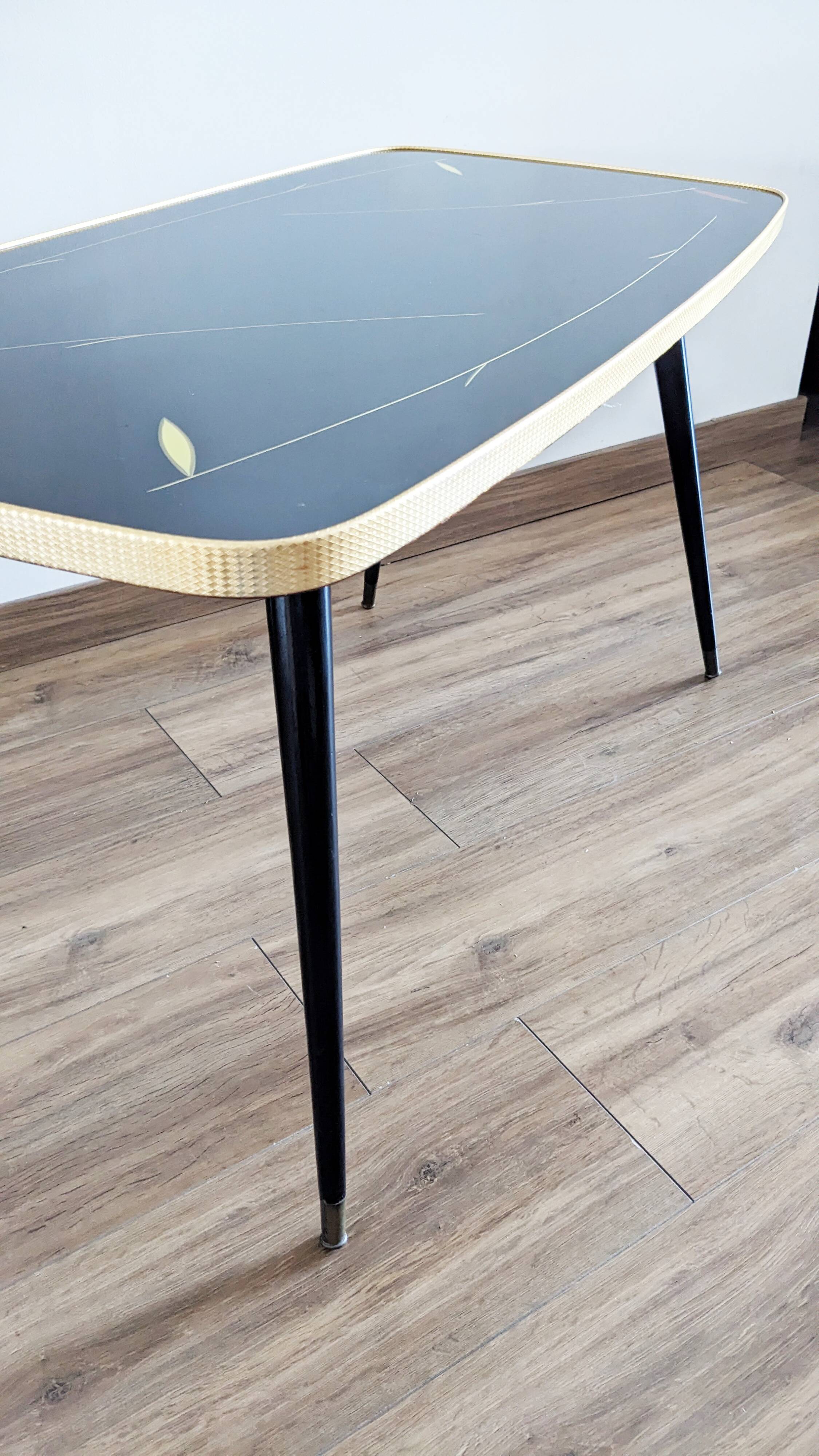 Glass coffee table with spindle legs